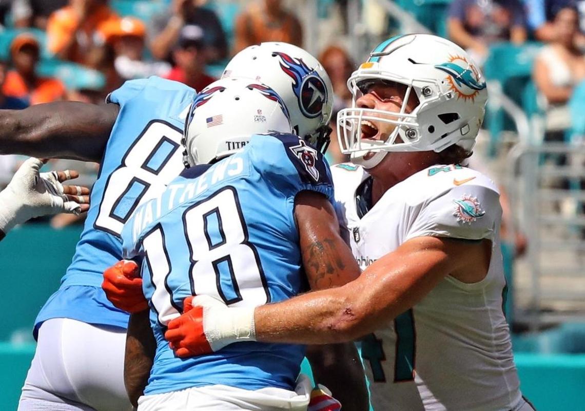 Miami Dolphins Kiko Alonso (47) tackles Tennessee Titans Rishard Mathews (18) in the second quarter at Hard Rock Stadium in Miami Gardens, Fla., Oct. 8, 2017.