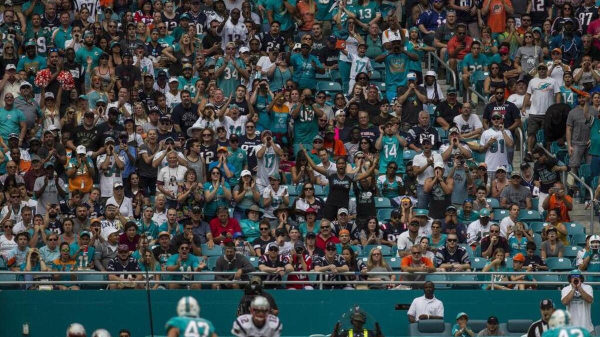 Miami Dolphins fans make some noise as New England Patriots quarterback Tom Brady (12) gets ready to snap the ball at Hard Rock Stadium last season. Stadium should be full in 2017.
