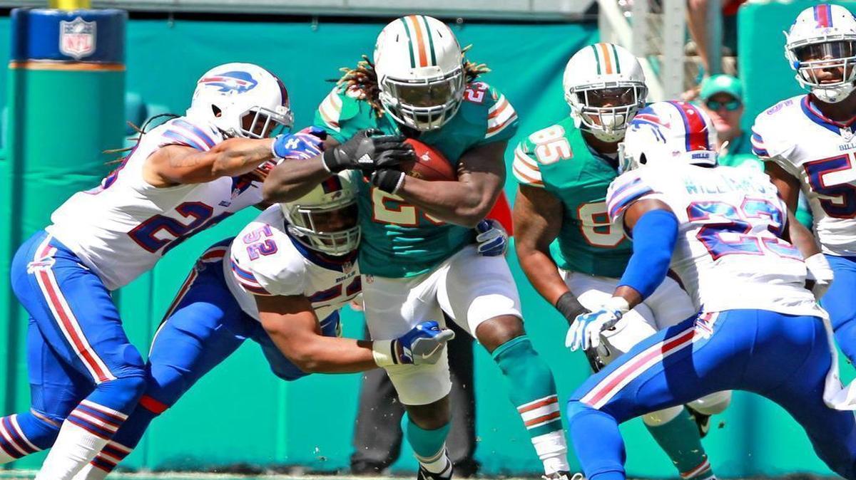 Miami Dolphins Jay Ajayi runs through the Buffalo Bills defense in the first quarter at Hard Rock Stadium in Miami Gardens, Florida, Oct. 23, 2016.