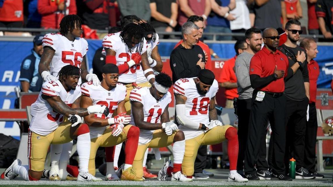 Members of the San Francisco 49ers kneel during the national anthem before an NFL football game against the Los Angeles Rams Sun., Dec. 31, 2017, in Los Angeles.