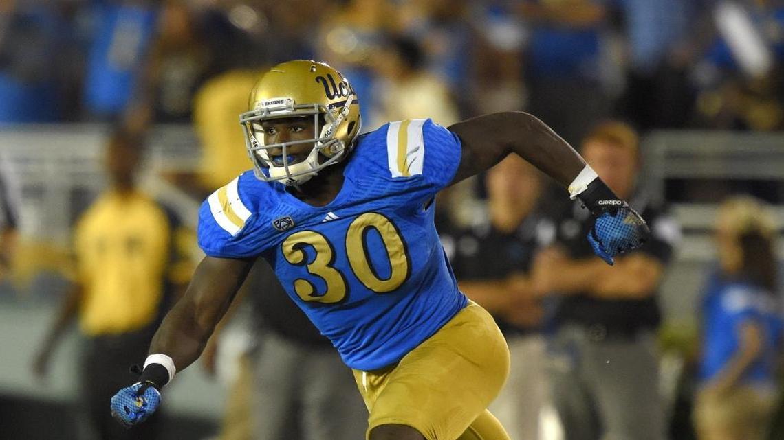 In this Sept. 6, 2014, file photo, UCLA linebacker Myles Jack runs during the second half of an NCAA college football game against Memphis in Pasadena, Calif. Jack only played on offense last year when UCLA lost to Arizona State in a game that ultimately decided the Pac-12 South. In the rematch, the No. 11 Bruins' two-way star is determined to do his "main job" against the Sun Devils' offense.