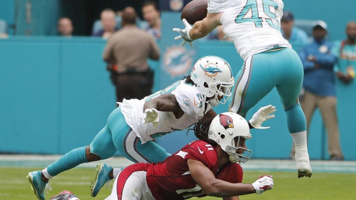 Miami Dolphins linebacker Mike Hull intercepts a pass against the Arizona Cardinals in December 2016.