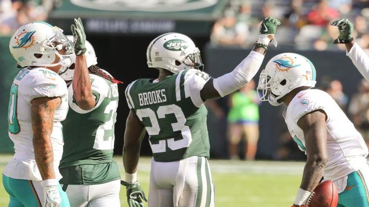 New York Jets defensive back Terrence Brooks (23) and free safety Marcus Maye (26) celebrate after Miami Dolphins wide receiver DeVante Parker (11) is short of a first on a fourth down attempt in the fourth quarter as the New York Jets host the Miami Dolphins at Met Life Stadium on Sunday, September 24, 2017.