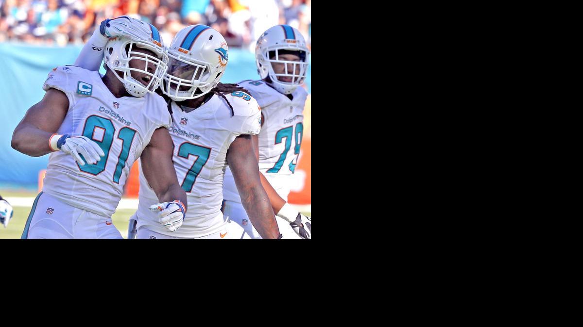 
Miami Dolphins’ Cameron Wake gets hugged by Kelvin Sheppard after a sack in the third quarter against the San Diego Chargers at Sun Life Stadium in Miami Gardens, Florida, on Sunday, Nov. 2, 2014.
