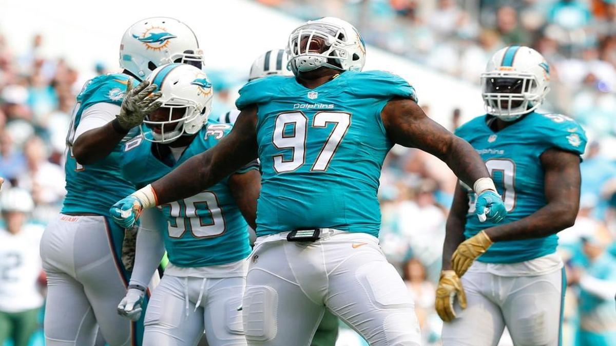 Miami Dolphins defensive tackle Jordan Phillips (97) and teammates react after a defensive play in the first quarter as the Miami Dolphins host the New York Jets at Hard Rock Stadium on Sunday, Nov. 6, 2016. The Dolphins are hoping defensive tackle Jordan Phillips suddenly becomes a mini-me of Ndamukong Suh.