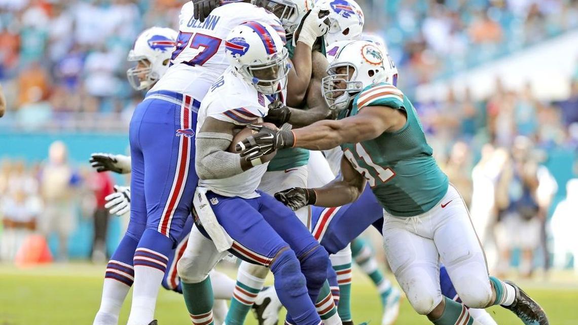 Buffalo Bills quarterback Tyrod Taylor (5) is sacked by Miami Dolphins defensive end Cameron Wake (91) in the fourth quarter as the Miami Dolphins host the Buffalo Bills at Hard Rock Stadium on Sunday, October 23, 2016.