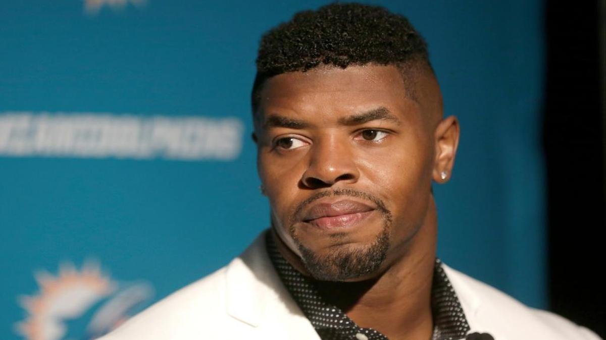 Dolphins defensive end Cameron Wake speaks to the media after Sunday’s game against the New England Patriots in Foxborough, Massachusetts. Wake says he’s OK with his limited role but his body language suggests otherwise.