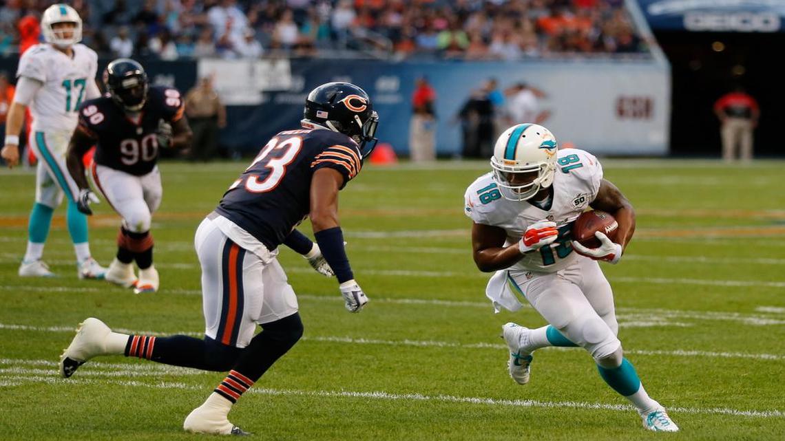 
Miami Dolphins wide receiver Rishard Matthews (18) tries to get past Chicago Bears cornerback Kyle Fuller (23) during the first half of an NFL preseason football game in Chicago, Thursday, Aug. 13, 2015.

