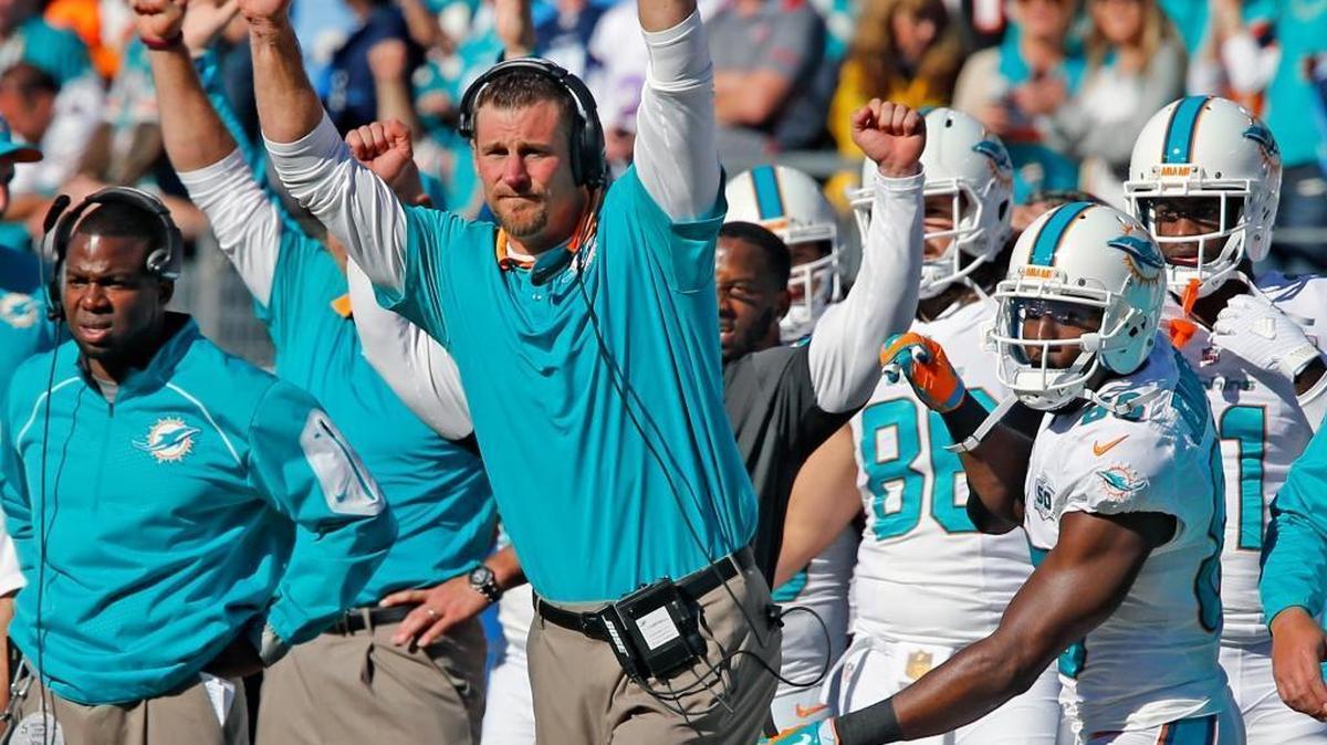 
Interim head coach Dan Campbell celebrates after the Dolphins’ final touchdown late in the fourth quarter in a 38-10 victory against the Tennessee Titans at Nissan Stadium in Nashville, Tenn., on Sunday, October 18, 2015.
