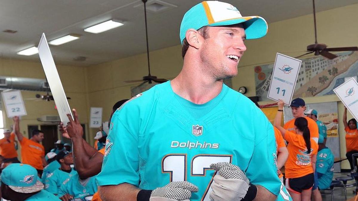 
Miami Dolphins quarterback Ryan Tannehill shares a laugh with teammates in the auditorium of Mae Walters Elementary School in Hialeah, where the team, staff and volunteers pitched in to beautify the school Wednesday June 10, 2015.
