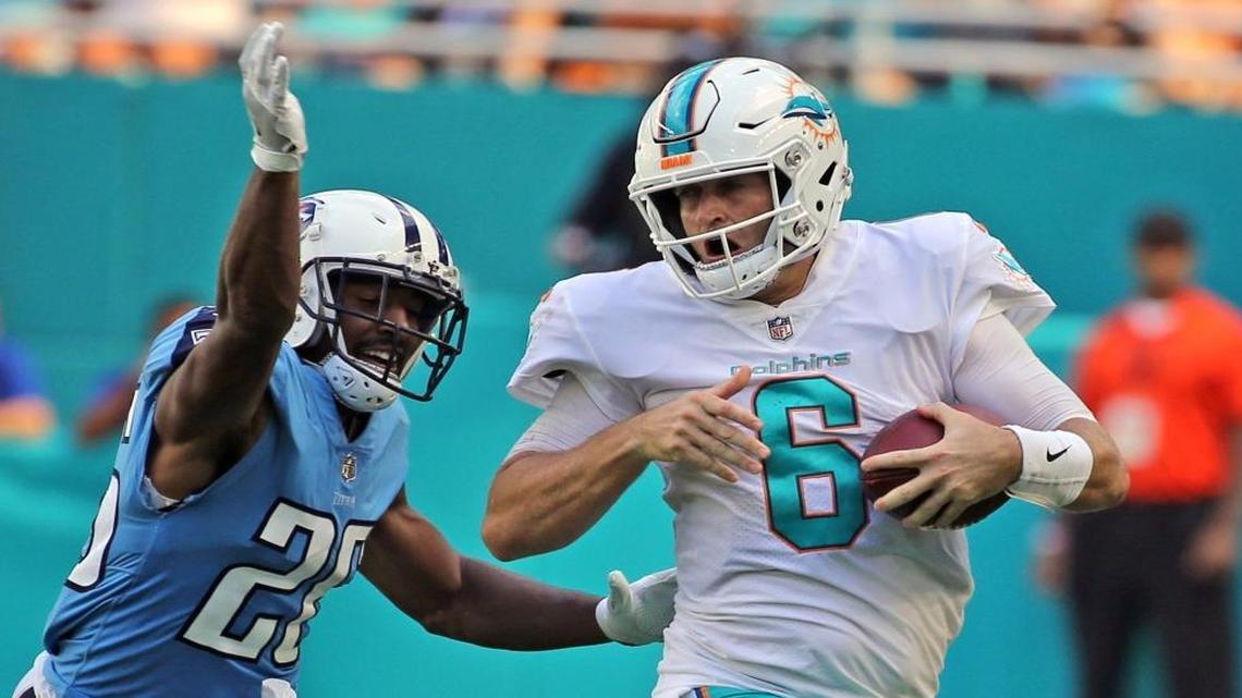 Miami Dolphins quarterback Jay Cutler runs away from Tennessee Titans Adoree Jackson (25) in the third quarter at Hard Rock Stadium Sunday.