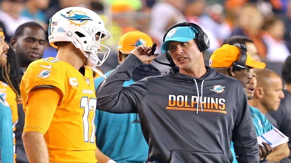 Dolphins coach Adam Gase talks with quarterback Ryan Tannehill as they play the Bengals in Cincinnati on Thursday night. ‘There are a lot of things we’d like to clean up,’ Gase said of his team. ‘You go through this first part of the season and you just want to make sure that every game you’re trying to get better; you’re making improvements from the mistakes from the week before.’