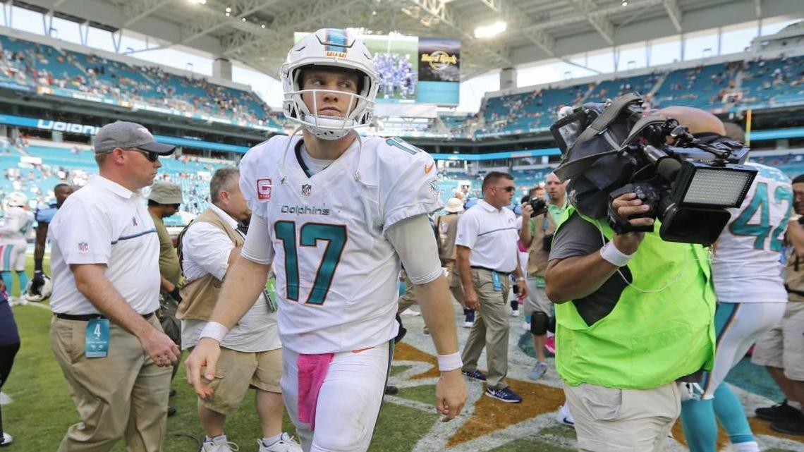 Miami Dolphins quarterback Ryan Tannehill (17) walks off the field after the Miami Dolphins are defeated by the Tennessee Titans 30-17 at Hard Rock Stadium on Sunday, October 9, 2016.