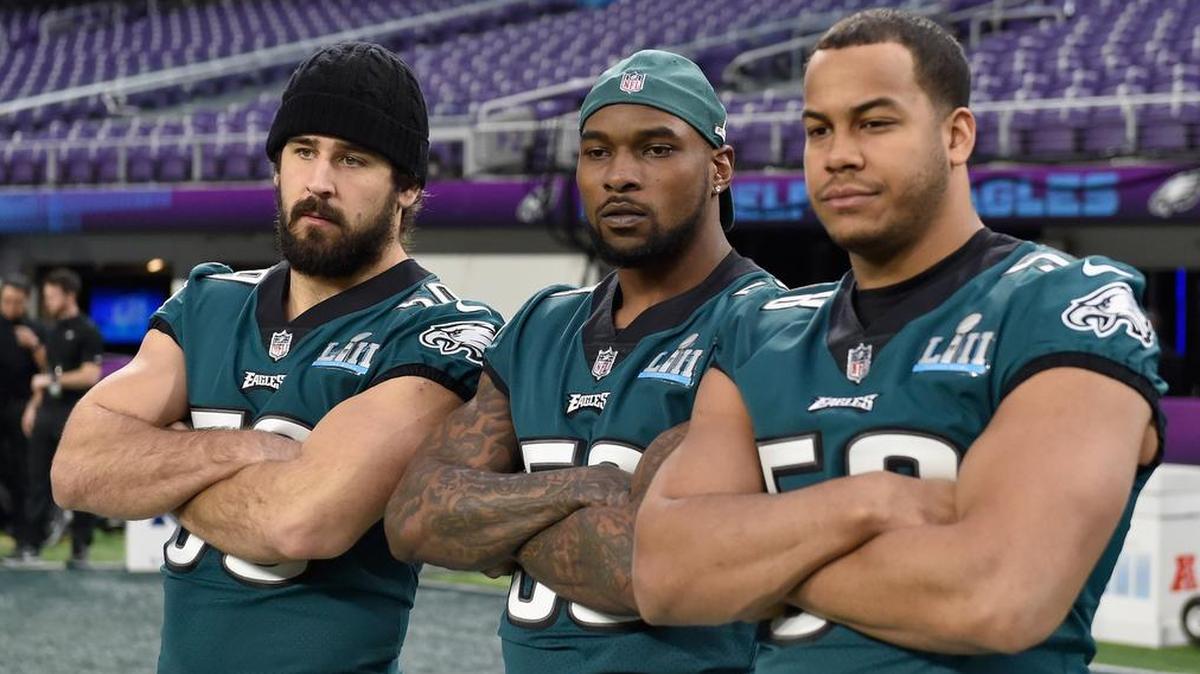 Joe Walker, left, Nigel Bradhamm, center, and Jordan Hicks of the Philadelphia Eagles look on during Saturday’s practice.
