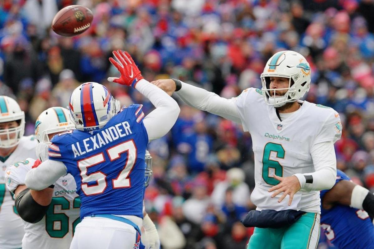 Miami Dolphins quarterback Jay Cutler (6) throws a pass over Buffalo Bills' Lorenzo Alexander (57) during the second half of an NFL football game Sun., Dec. 17, 2017, in Orchard Park, N.Y.