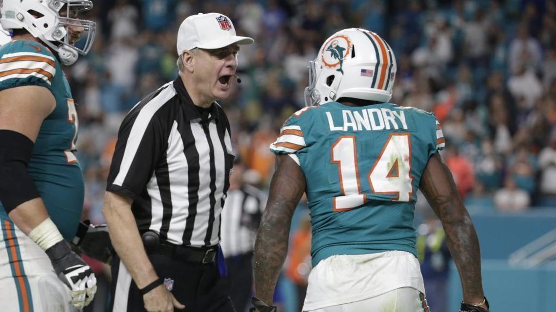 NFL referee Jeff Triplette ejects wide receiver Jarvis Landry in the fourth quarter of the Miami Dolphins’ season finale.