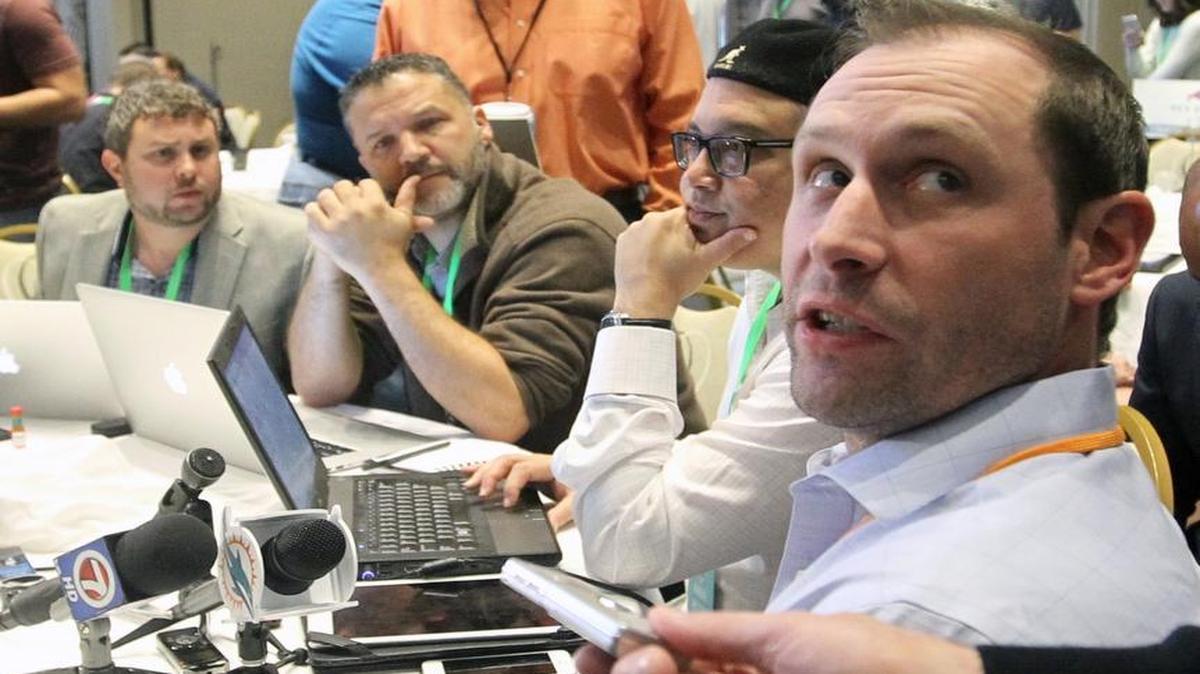 Miami Dolphins football head coach Adam Gase, right, talks to members of the media at the NFL owners meeting in Boca Raton, Fla., Tuesday, March 22, 2016.