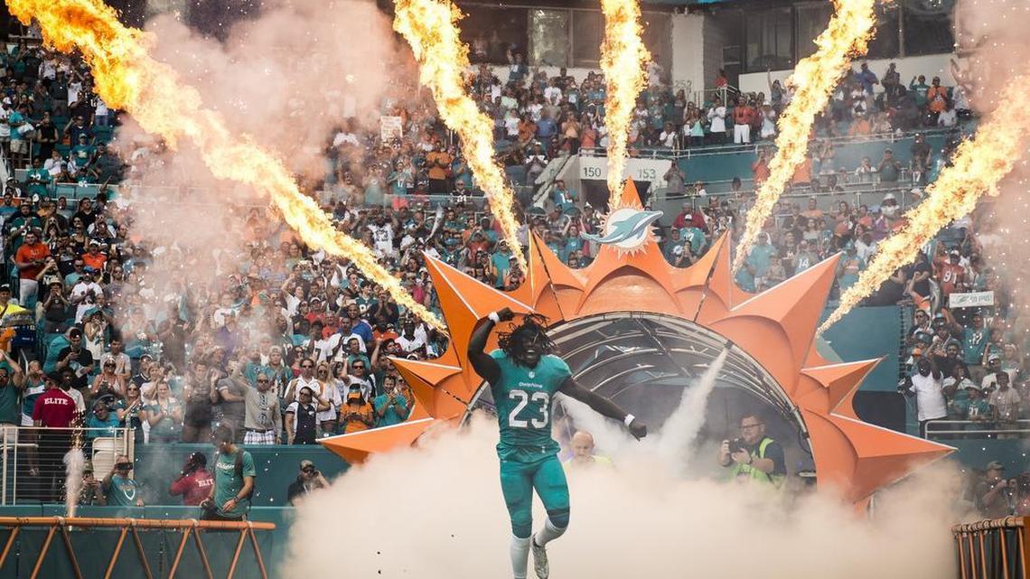 Miami Dolphins running back Jay Ajayi makes his entrance into the game versus the New England Patriots at Hard Rock Stadium in January 2017.