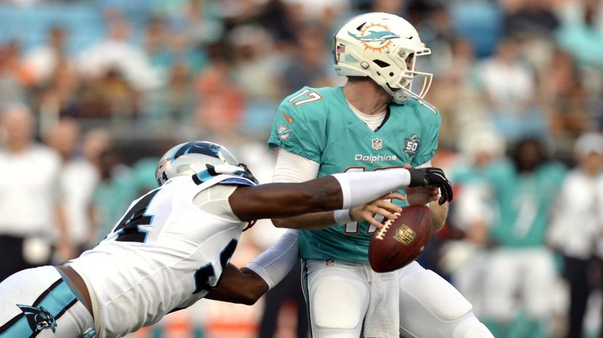 
Dolphins quarterback Ryan Tannehill is stripped of the football by the Carolina Panthers’ Kony Ealy on Saturday. Tannehill has otherwise been sharp this preseason, with a 126.9 rating.
