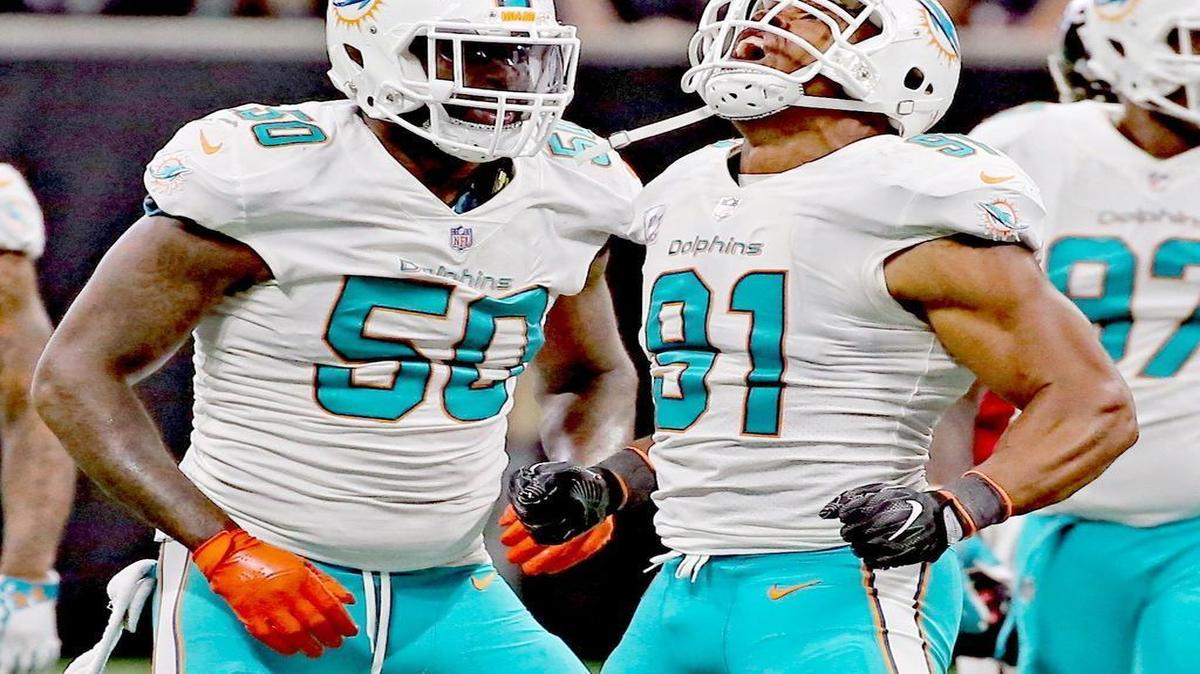 Miami Dolphins Andre Branch and Cameron Wake celebrate after sacking Atlanta Falcons quarterback Matt Ryan in 2017.
