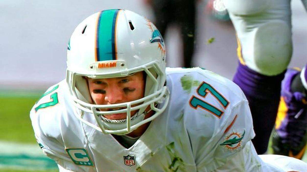 
Miami Dolphins quarterback Ryan Tannehill lays on the field after Minnesota Vikings defender Harrison Smith recoverd a fumble in the second quarter at Sun Life Stadium in Miami Gardens on Sept. 21, 2014.
