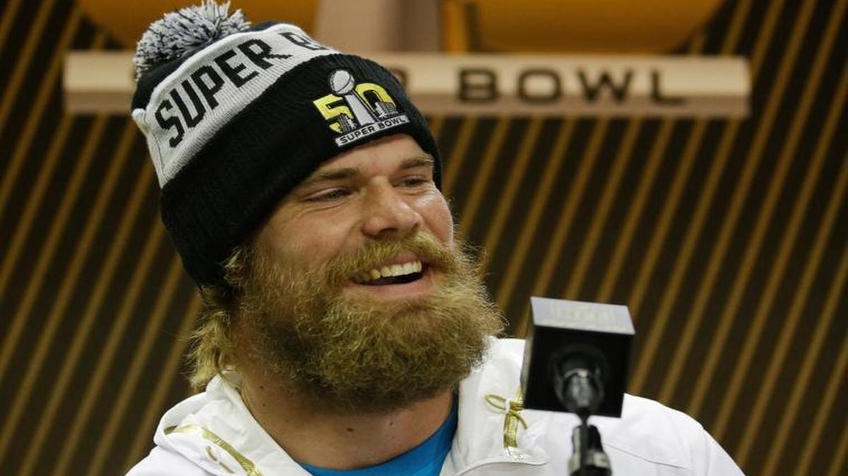 Carolina Panthers tight end Greg Olsen listens to a question during Opening Night for the NFL Super Bowl 50 football game Monday, Feb. 1, 2016, in San Jose, Calif.