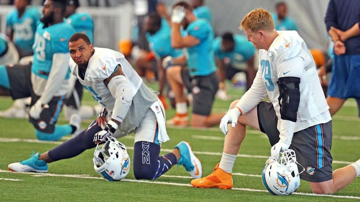 Former Dolphins offensive tackle Sam Young (right) was cut on Saturday, helping to ruin Armando Salguero’s 53-man mock roster predictions.