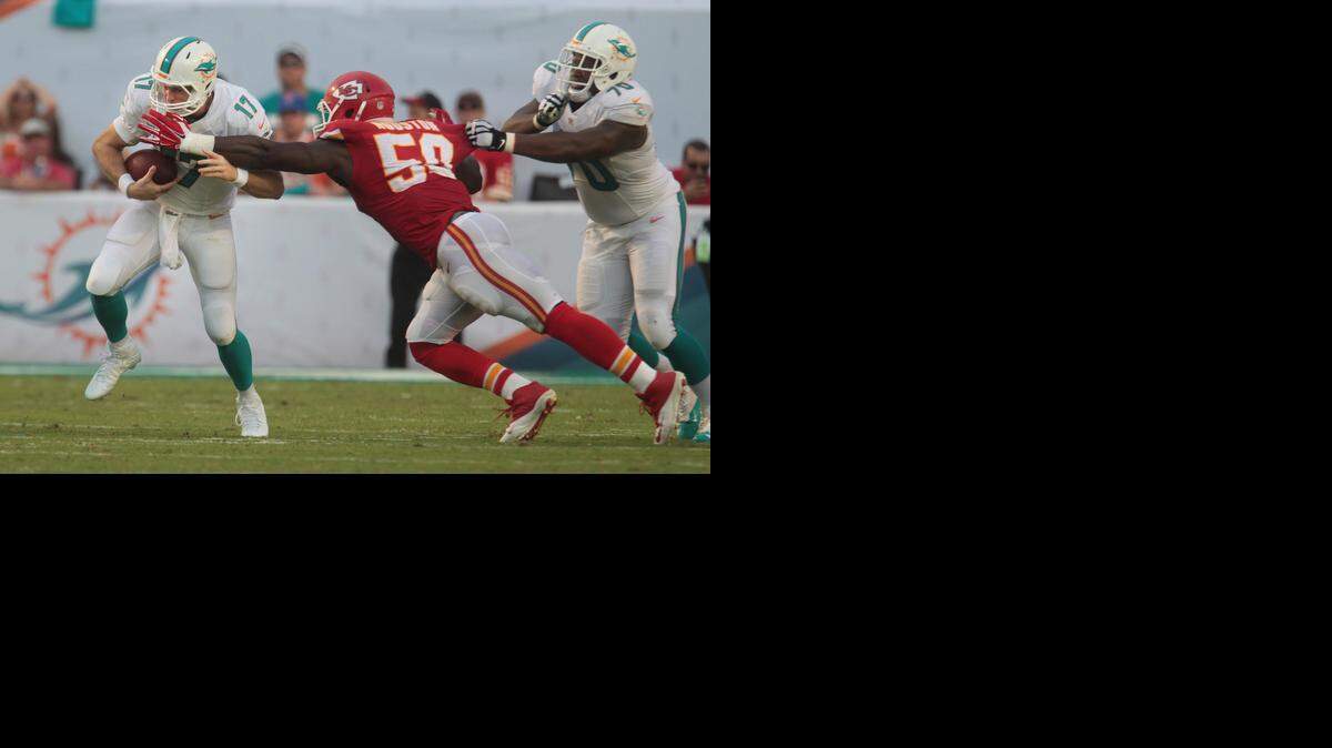 
Miami Dolphins quarterback Ryan Tannehill is sacked in the fourth quarter by Kansas City Chiefs defender Justin Houston at Sun Life Stadium in Miami Gardens, Fla., on Sunday, Sept. 21, 2014.
