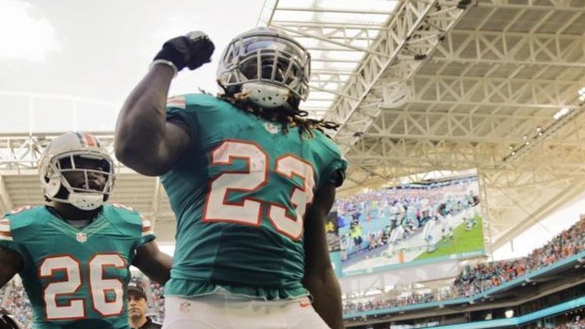 Miami Dolphins running back Jay Ajayi (23) celebrates after scoring in the second quarter as the Miami Dolphins host the 49ers at Hard Rock Stadium in Miami Gardens on Sun., Nov. 27, 2016.
