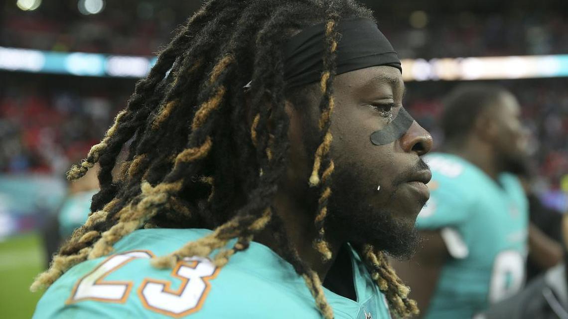 Miami Dolphins running back Jay Ajayi leaves the field apparently in tears after an NFL football game against the New Orleans Saints at Wembley Stadium in London.
