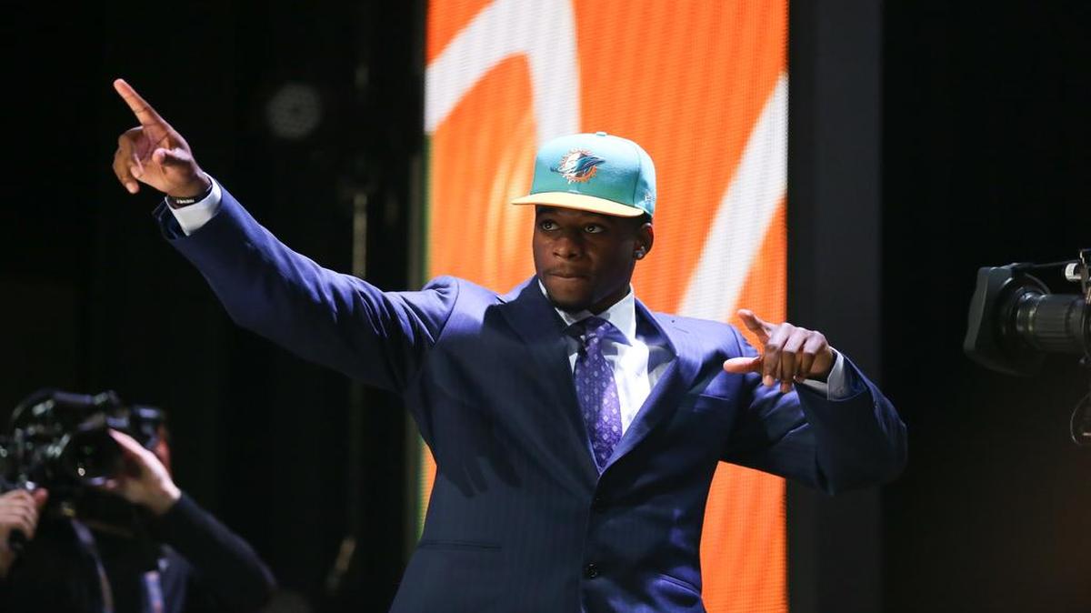 
DeVante Parker of the Louisville Cardinals walks on stage after being picked #14 overall by the Miami Dolphins during the first round of the 2015 NFL Draft at the Auditorium Theatre of Roosevelt University on April 30, 2015 in Chicago, Illinois.

