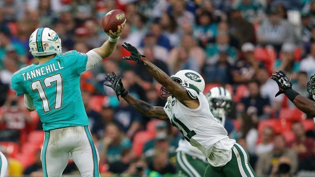 Dolphins quarterback Ryan Tannehill was continually under pressure Sunday from a myriad of Jets blitzes, like this one from New York cornerback Buster Skrine.