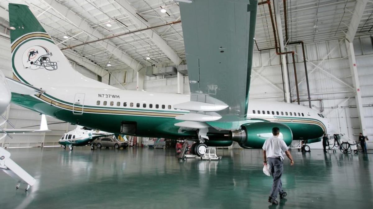 The private Boeing 737 owned by Miami Dolphins owner Wayne Huizenga is seen in a hangar in Fort Lauderdale in 2006. When Huizenga used to fly in style, his Gulfstream had room for only a dozen or so guests. Now his private jet fits more more than twice that many passengers in a cabin that would seat up to 150 as a commercial airliner.