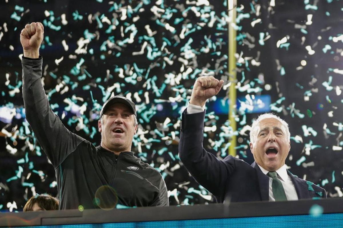 Philadelphia Eagles head coach Doug Pederson, left, and owner Jeffrey Lurie celebrate after the NFL Super Bowl 52 football game against the New England Patriots, Sunday, Feb. 4, 2018, in Minneapolis. The Eagles won 41-33.