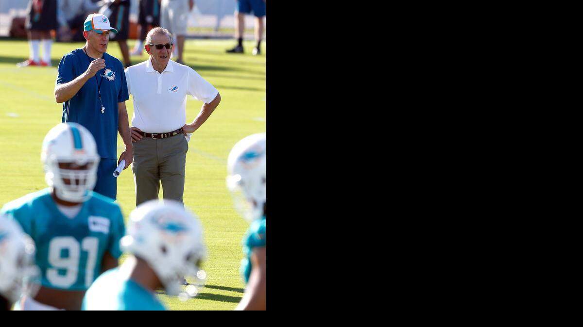 
Boss Ross is happy: Coach Joe Philbin, left, had the Dolphins playing the type of ‘fun’ football in the opener that owner Stephen Ross wants to see.
