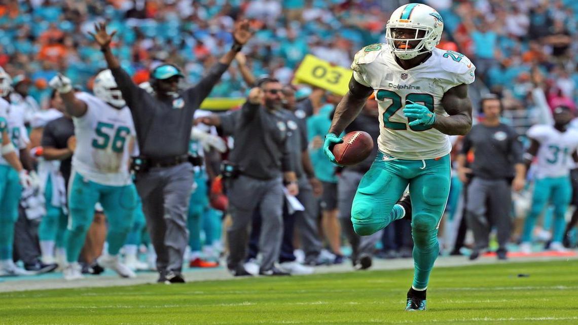 Miami Dolphins Reshad Jones here scoring a touchdown against the Tennessee Titans, was one player who restructured his contract this week.