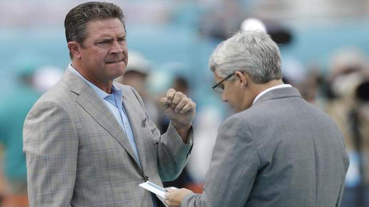 <cutline_leadin>The best intentions:</cutline_leadin> Dan Marino, talking with GM Dennis Hickey on the sideline on Oct. 12, has been working with the Dolphins’ quarterbacks.