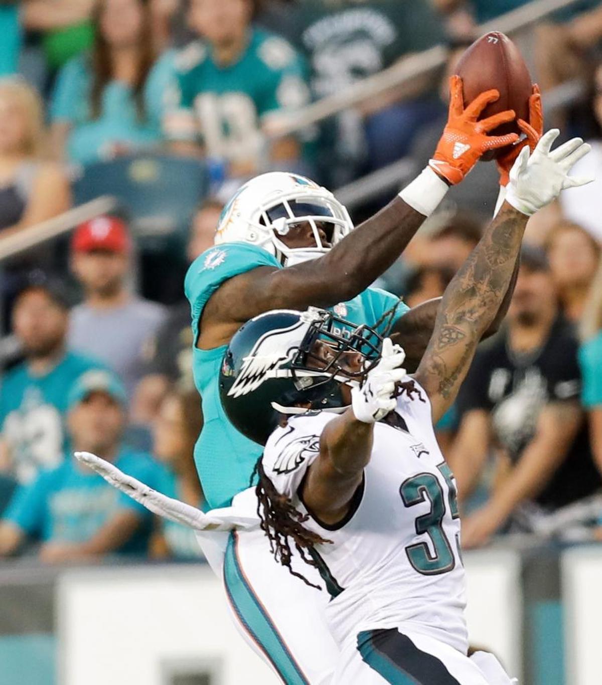 Miami Dolphins wide receiver DeVante Parker catches a pass over Philadelphia Eagles cornerback Ronald Darby during the first quarter on Thurs., Aug. 24, 2017, at Lincoln Financial Field in Philadelphia.