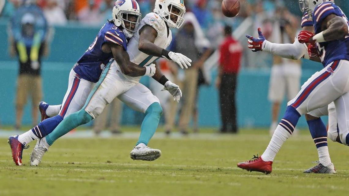 Pass intended for Miami Dolphins wide receiver Jarvis Landry (14) is picked off by Buffalo Bills middle linebacker Preston Brown (52) in the first quarter. The Miami Dolphins host the Buffalo Bills in the home opener at Sun Life Stadium in Miami Gardens on Sun., Sept. 27, 2015.
