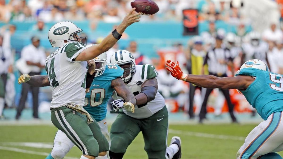 Miami Dolphins defensive end Andre Branch (50) puts pressure on New York Jets quarterback Ryan Fitzpatrick (14) in the third quarter as the Miami Dolphins host the New York Jets at Hard Rock Stadium on Sunday, November 6, 2016.