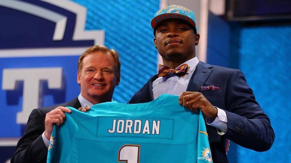 
Dion Jordan stands with NFL Commissioner Roger Goodell as they hold up a jersey on stage after he was picked #3 overall by the Miami Dolphins in the first round of the 2013 NFL Draft at Radio City Music Hall on April 25, 2013 in New York City. 
