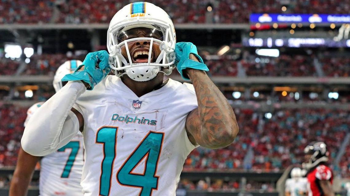 Receiver Jarvis Landry celebrates after scoring a third quarter touchdown against the Falcons on Sunday.