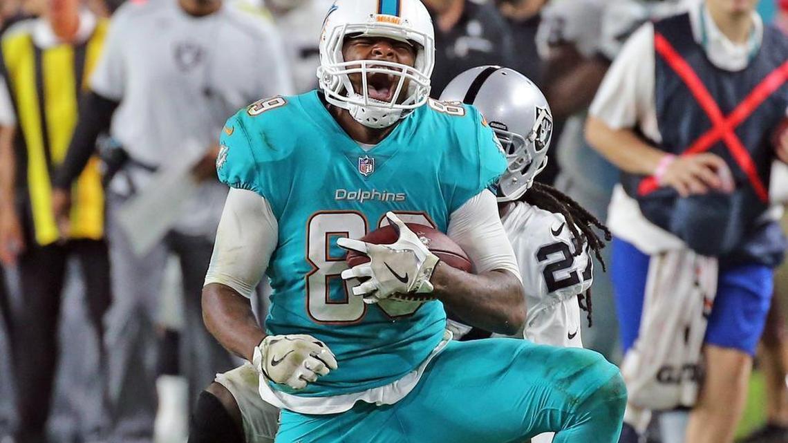 Miami Dolphins tight end Julius Thomas screams after a fourth-quarter catch against the Oakland Raiders in 2017.