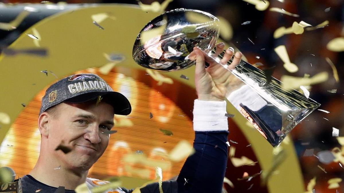 Denver Broncos Peyton Manning holds up the trophy after the NFL Super Bowl 50 football game Sunday, Feb. 7, 2016, in Santa Clara, Calif. The Broncos won 24-10.