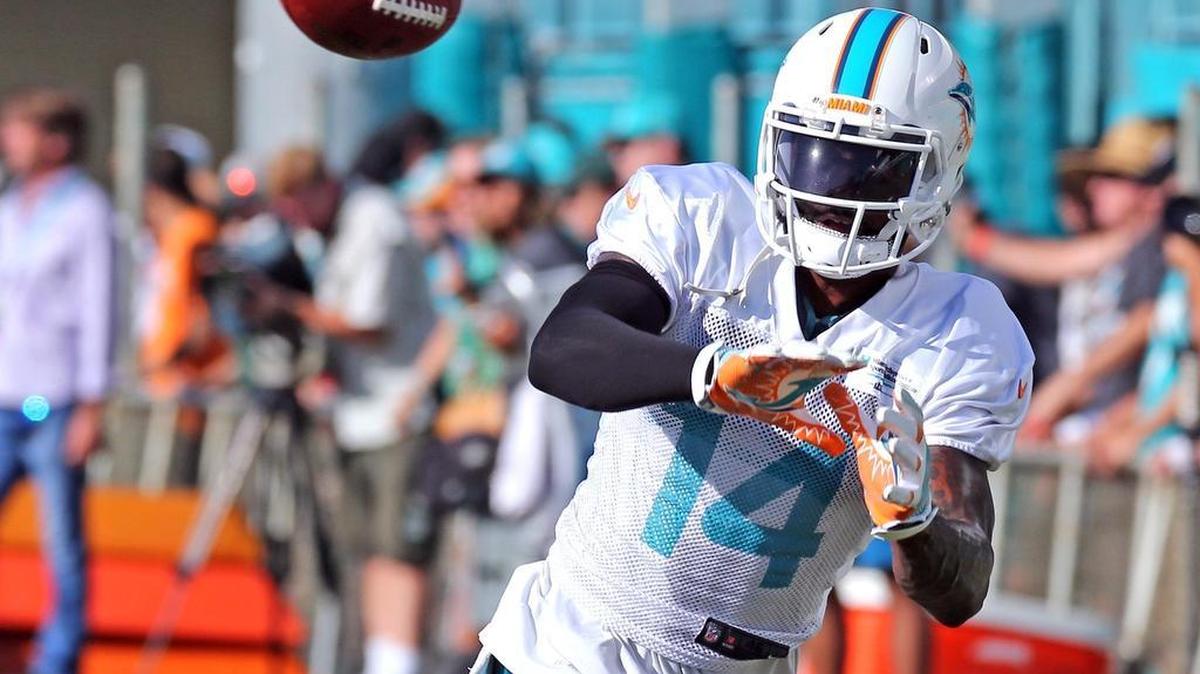 Miami Dolphins receiver Jarvis Landry catches a ball during training camp.