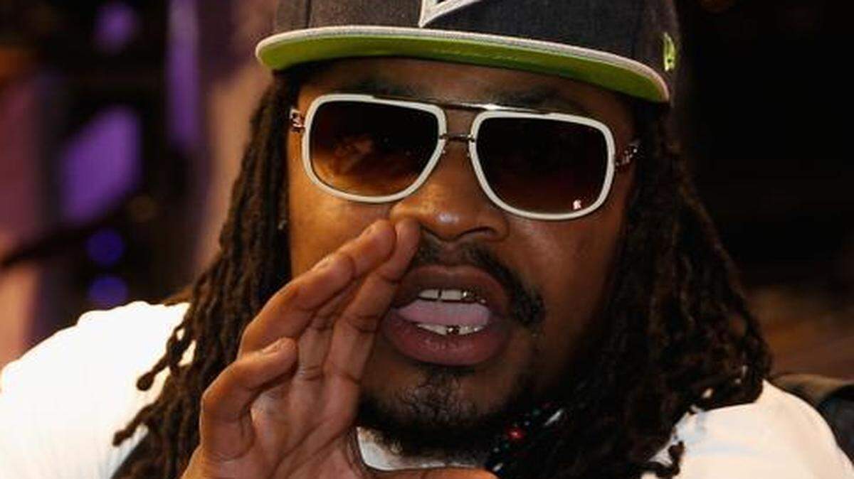 
Marshawn Lynch of the Seattle Seahawks addresses the media at Super Bowl XLIX Media Day on Jan. 27, 2015 in Phoenix, Arizona.
