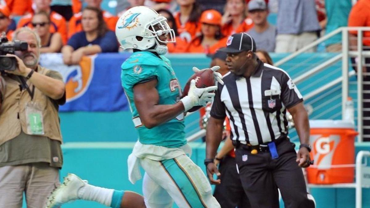 Miami Dolphins RB Kenyan Drake runs for a third quarter touchdown against Denver this past Sunday. Drake has thrived since the Dolphins traded Jay Ajayi to Philadelphia.