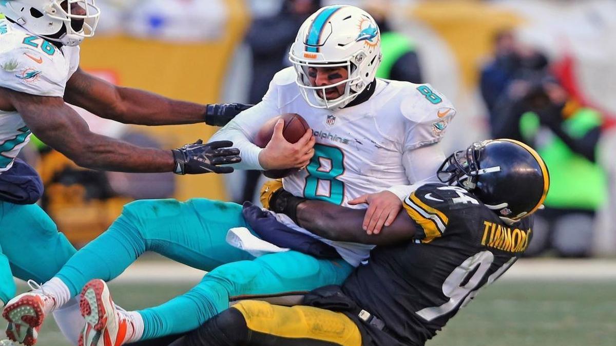 Miami Dolphins quarterback Matt Moore gets sacked by Pittsburgh Steelers' Lawrence Timmons in the second half of an AFC wild-card NFL football game in Pittsburgh on Sun., Jan. 8, 2017.