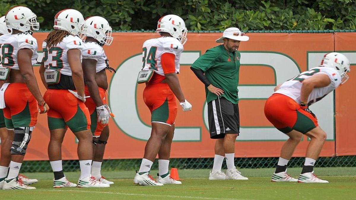 Defensive coordinator Manny Diaz, instructs defensive linemen during practice. On Thurs., Aug. 11, 2016 Hurricane football team practiced as the team prepares for the upcoming season at the University of Miami Greentree Field in Coral Gables, Florida.