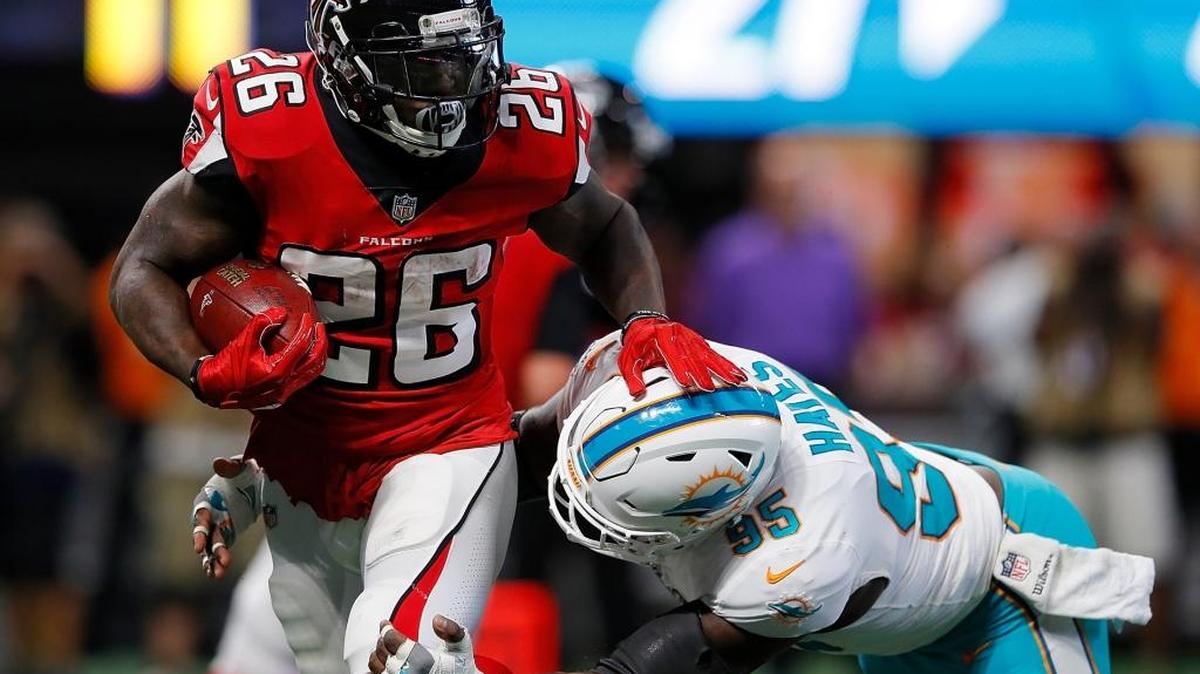 ATLANTA, GA - OCTOBER 15: William Hayes #95 of the Miami Dolphins tackles Tevin Coleman #26 of the Atlanta Falcons at Mercedes-Benz Stadium on October 15, 2017 in Atlanta, Georgia. (Photo by Kevin C. Cox/Getty Images)